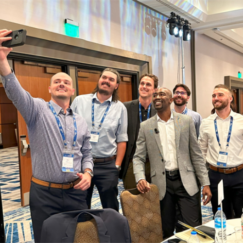 Group of attendees taking a selfie.