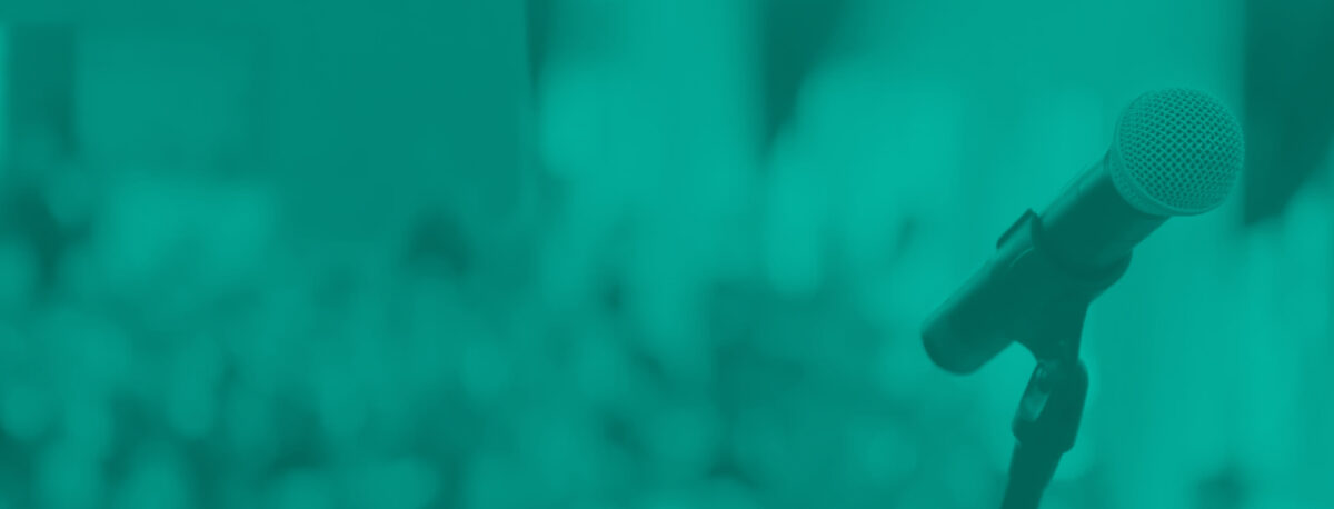 A microphone in front of a crowd.